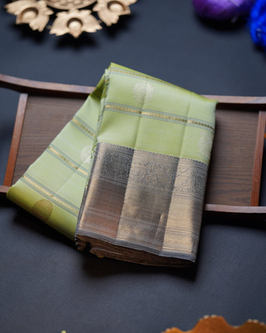 Apple Green Saree with Contrast Grey Border, Bhel Dhari Weave, Poo Chakram & Annapakshi Butta, and Mayil Motif Accents