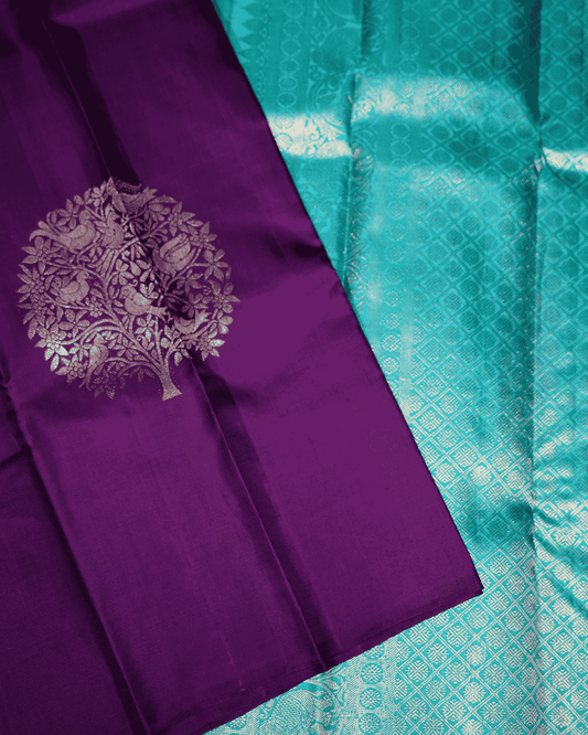 Violet Borderless Kanchipuram Pure Silk Saree adorned with Elegant Tree Bird Butta Motifs and Opulent Two Gram Gold Zari