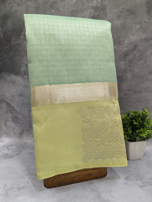 Shop online for bluish green designer wedding sarees featuring Annapakshi motif on border