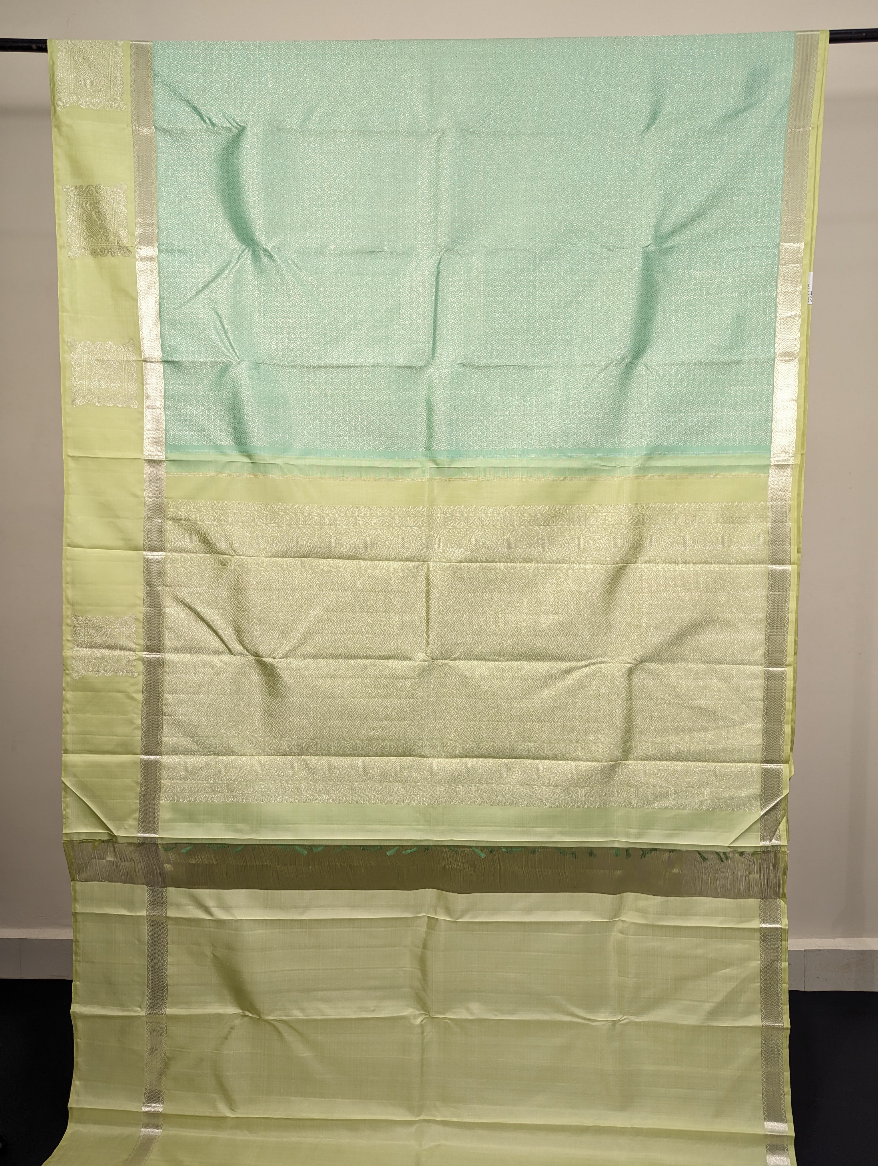 Shop online for bluish green designer wedding sarees featuring Annapakshi motif on border