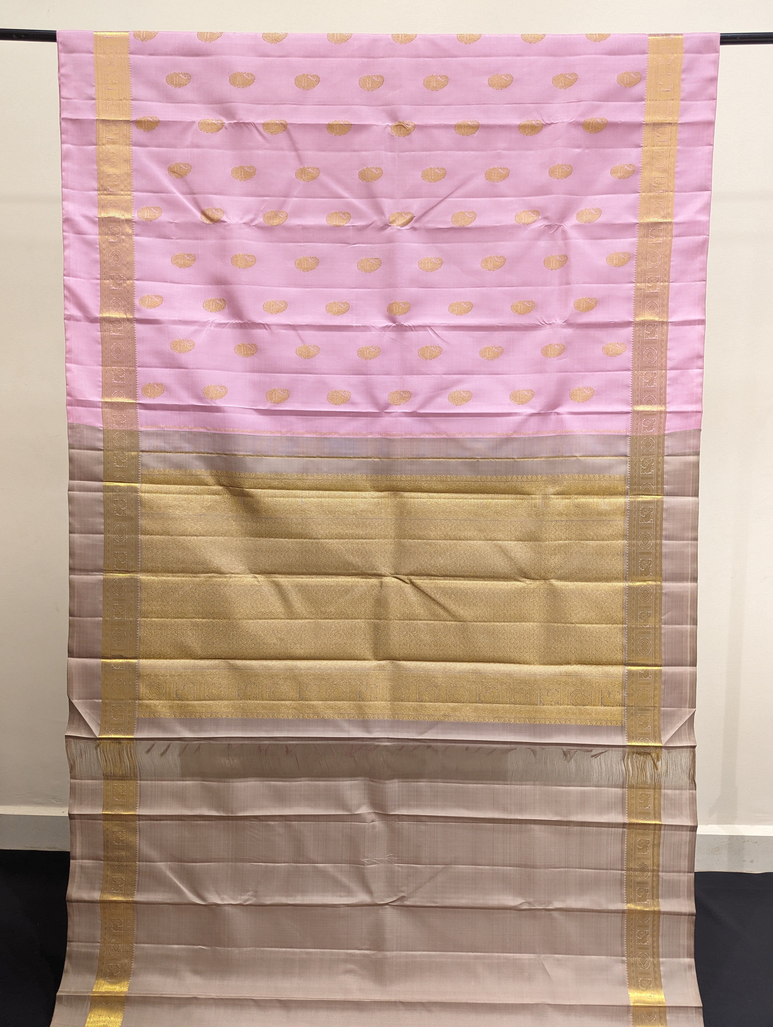 Elegant pink silk saree with shimmering gold border