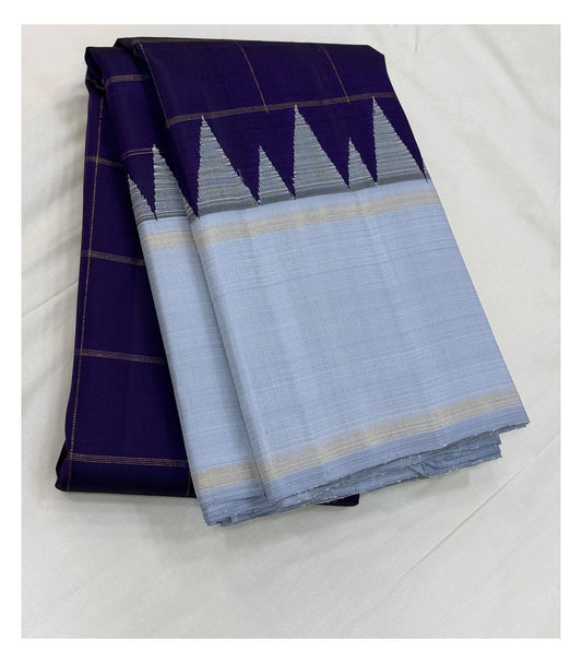 Handwoven Kanchipuram silk saree in deep purple and ice blue with a geometric contrast border