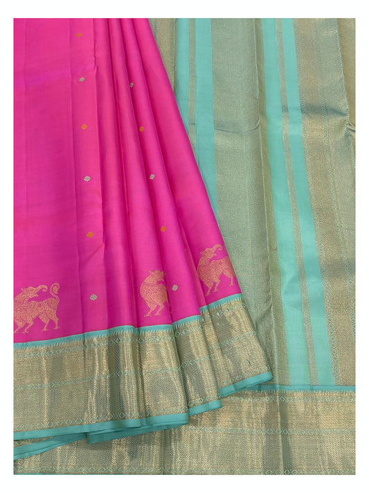 Detailed drape view of the pink Kanchipuram silk saree with aqua zari pallu and woven elephant motifs.