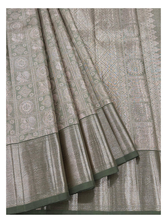 Detailed view of handwoven Kanchipuram silk saree showing motif panels and antique gold woven border