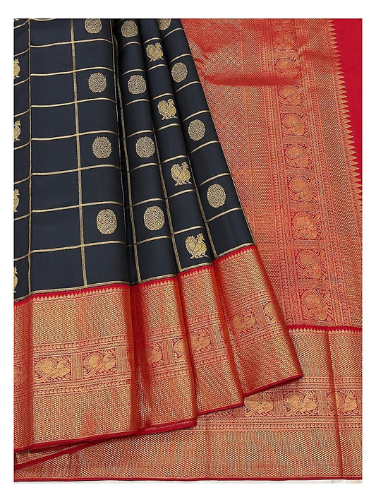 Close view of the navy blue saree with gold-toned checks, woven motifs, and broad red pallu