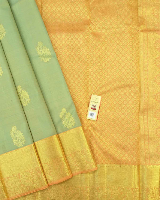 Ivory Traditional Saree with Golden Zari Buttas and Intricate Pallu