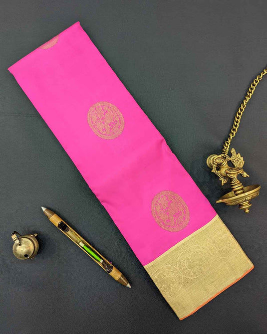 Luxurious pink and gold silk sari featuring ornate gold border