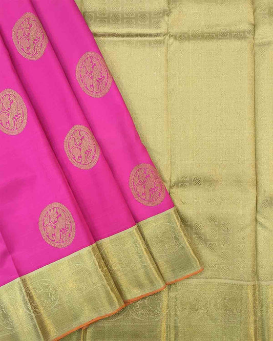 Luxurious pink and gold silk sari featuring ornate gold border