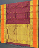 Dark red and orange silk saree with Annam Border, featuring gold