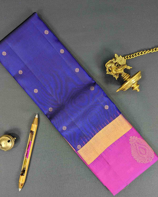 Traditional dark blue silk saree from Kancheepuram with zari border and detailed pallu