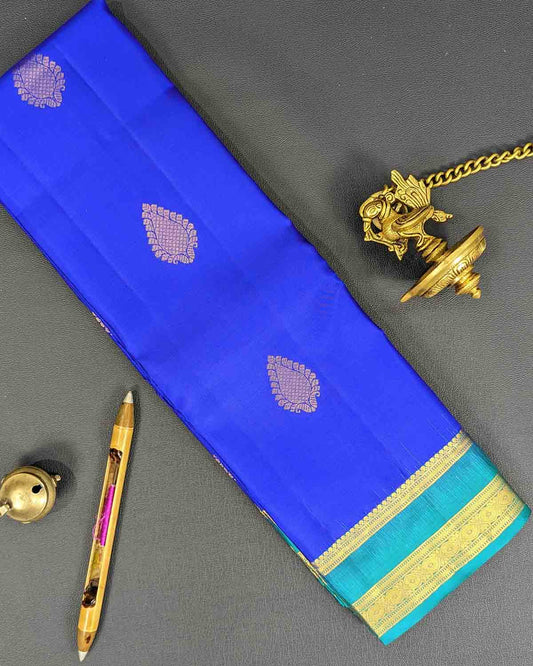 Blue Traditionally Kancheepuram Silk Sarees With Paisley Buttas And Ornate Pallu Green Border