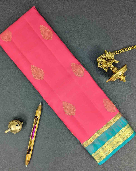 Pink Kancheepuram Silk Saree with Green Lineated Border & Leaf-Shaped Motifs.