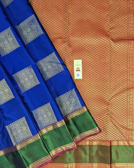 Timeless blue Kancheepuram silk saree with square buttas and a dual-color intricate border