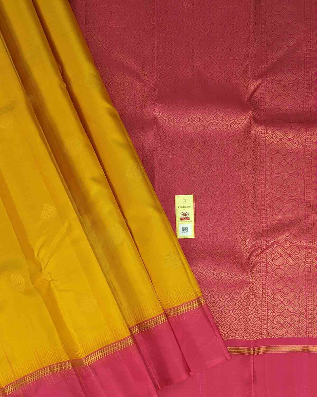 Elegant yellow and pink silk sari with intricate gold border design
