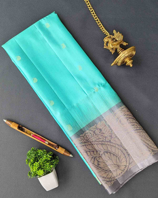 Elegant blue Kanchipuram soft silk saree featuring Annapakshi buttas and ash border