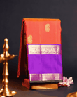 Luxurious Kanchipuram Silk Saree in Vibrant Orangish Pink & Violet with Dual Rettai Border, Mango Butta Motifs, and Premium One Gram Gold Zari