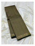 Folded deep green silk saree showing gold-toned woven stripe pattern and border