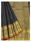 Detailed view of the handwoven saree border and pallu with gold-toned woven peacock motifs and black checked pleats
