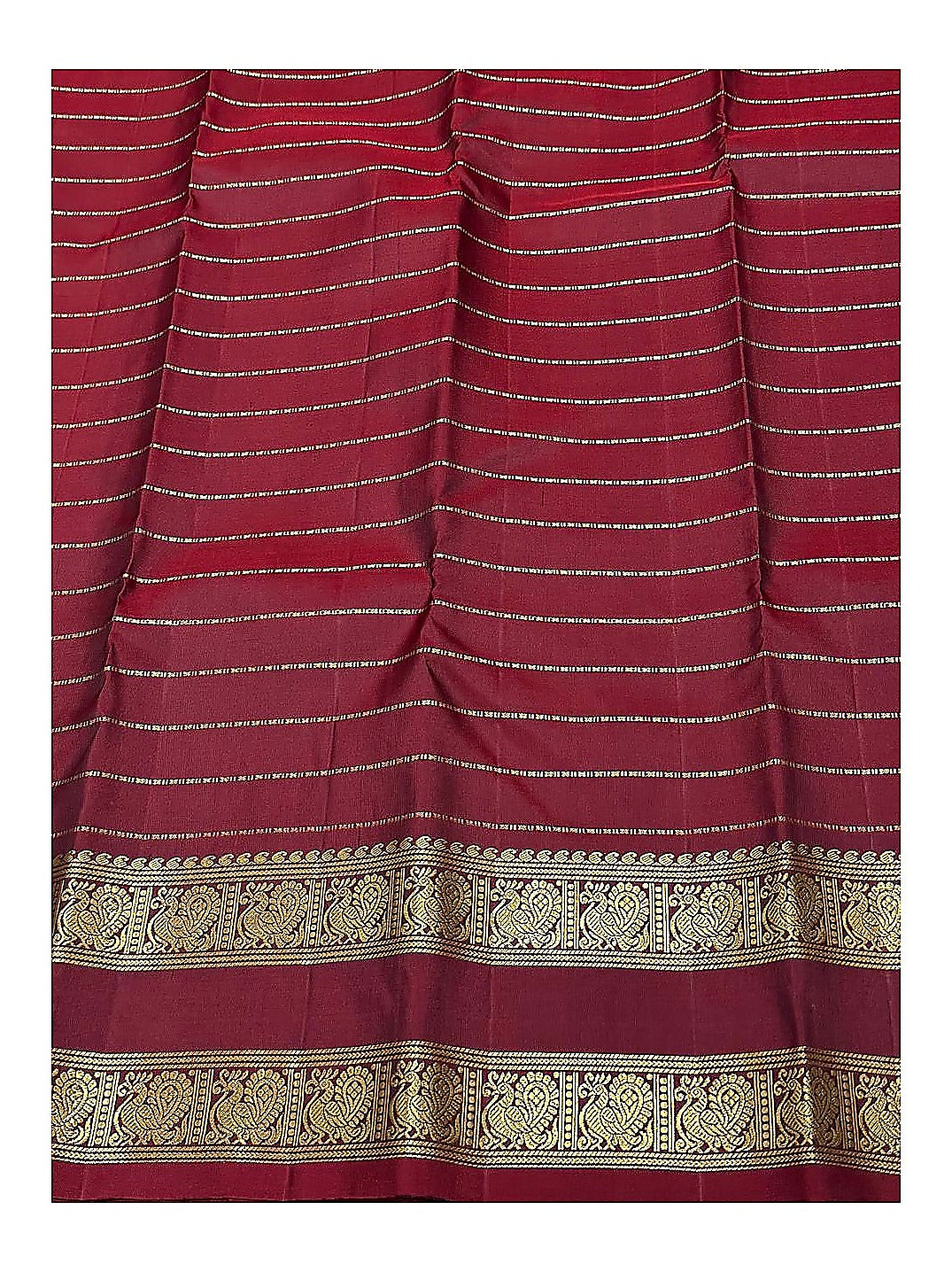 Maroon pallu detail with gold-toned woven stripes and peacock border on handwoven Kanchipuram silk saree