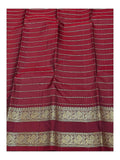 Maroon pallu detail with gold-toned woven stripes and peacock border on handwoven Kanchipuram silk saree