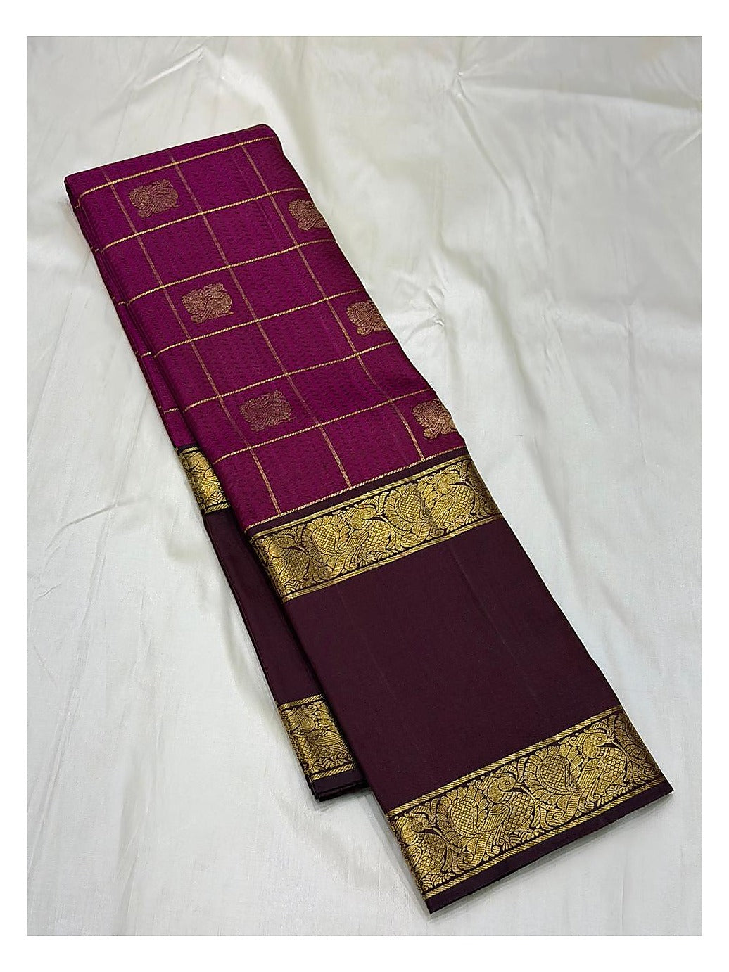 Checked body view of the handwoven Kanchipuram silk saree in deep magenta with plum border and pallu