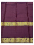 Close view of the plum section with broad peacock-style woven zari border