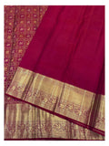 Matching magenta blouse piece and gold-toned border detail of handwoven Kanchipuram silk saree