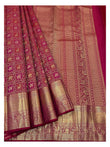 Close view of woven pallu and border on deep magenta Kanchipuram silk saree with gold-toned detailing
