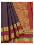 Detailed view of the saree showing the deep plum body, maroon border, and richly woven gold-toned pallu