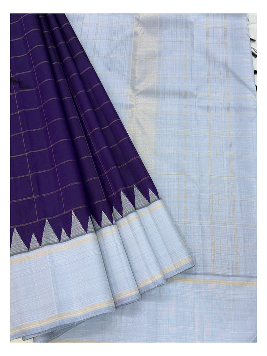 Draped detail of the deep purple checked body and ice blue border of the handwoven Kanchipuram silk saree