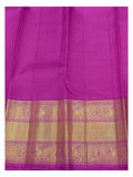 Close view of the magenta and gold-toned elephant motif border on a handwoven Kanchipuram silk saree