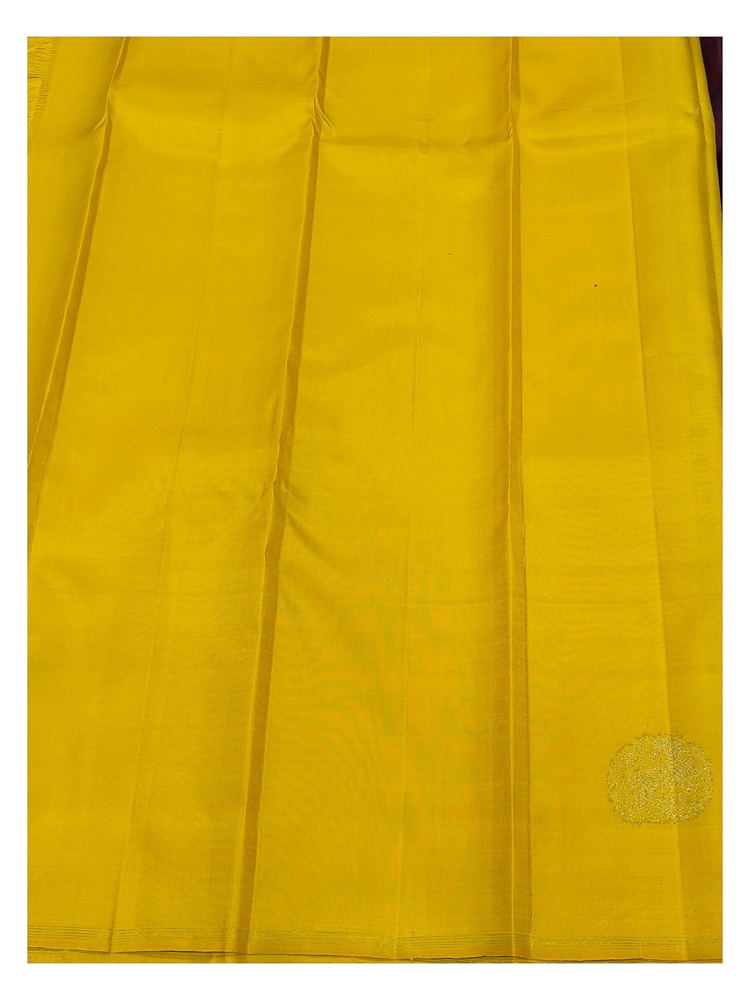 Contrast yellow section of the handwoven Kanchipuram silk saree with gold-toned woven motif