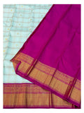 Contrast magenta pallu and gold-toned border of handwoven Kanchipuram silk saree