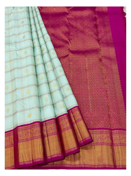 Draped view showing ice blue checked body and magenta patterned pallu of handwoven Kanchipuram silk saree