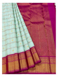 Draped view showing ice blue checked body and magenta patterned pallu of handwoven Kanchipuram silk saree