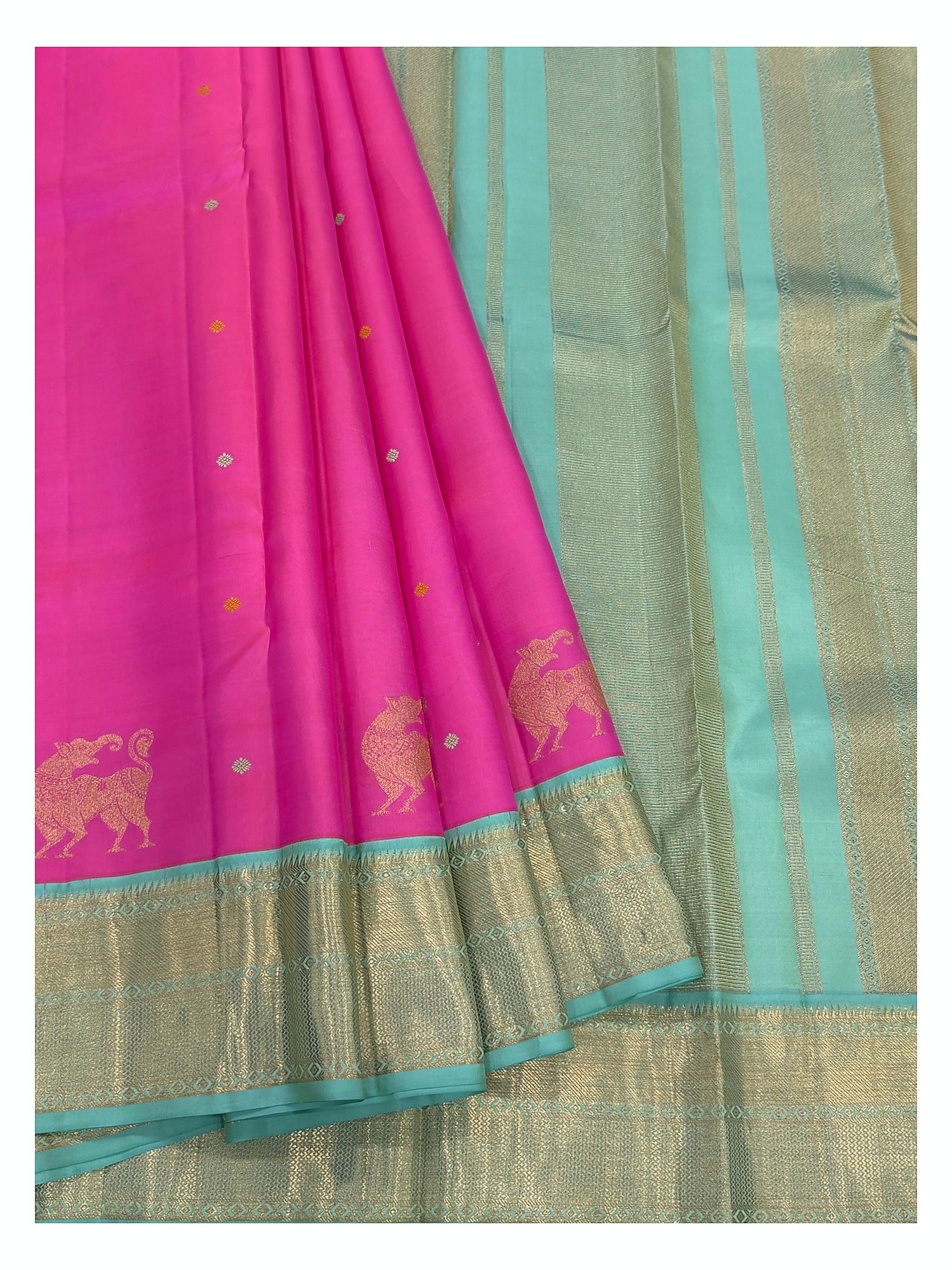 Detailed drape view of the pink Kanchipuram silk saree with aqua zari pallu and woven elephant motifs.