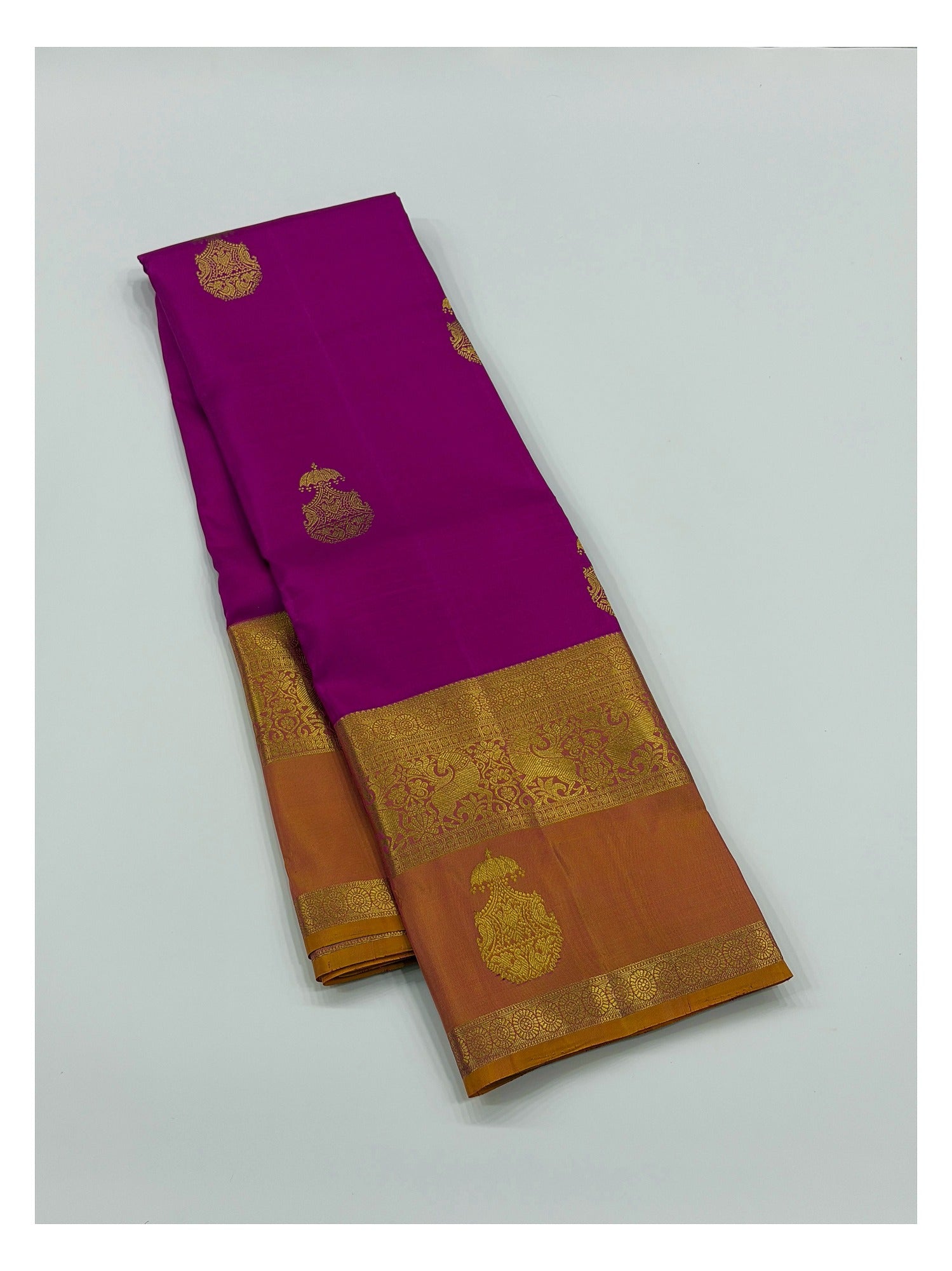 Handwoven Kanchipuram Silk Saree in Bright Magenta with Mustard-Gold Peacock Border front view