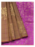 Handwoven Kanchipuram silk saree in cocoa brown with magenta floral pallu and gold-toned woven motifs