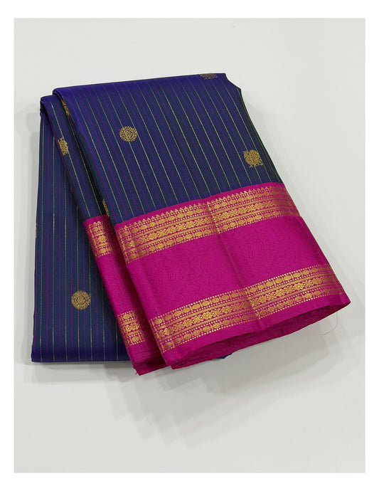 Handwoven Kanchipuram silk saree in deep blue with pink zari border folded display