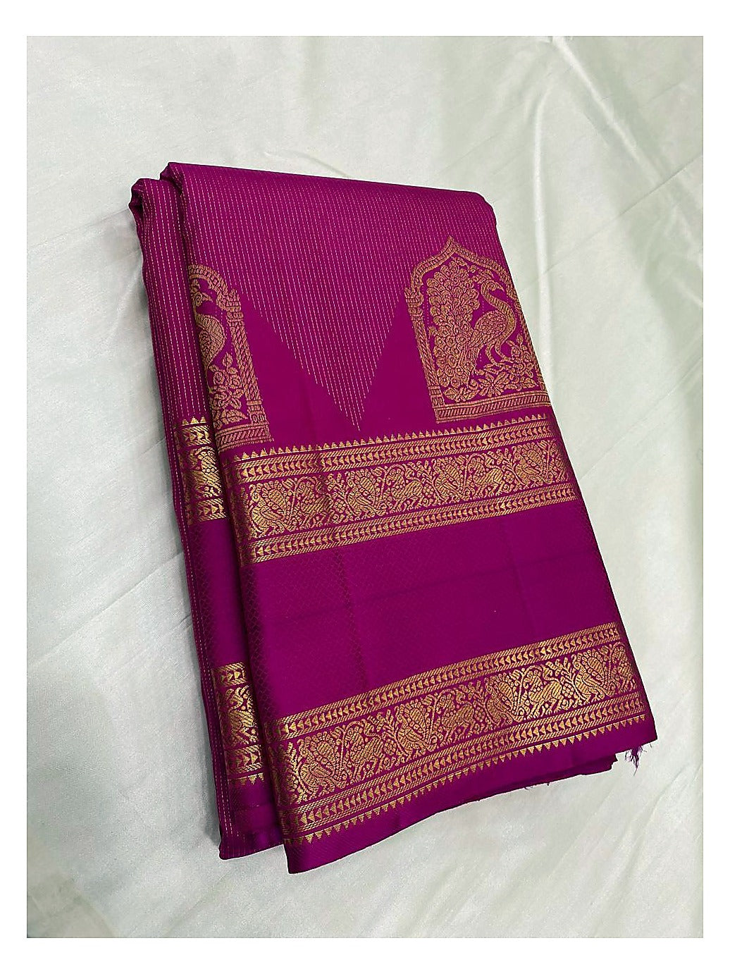 Handwoven Kanchipuram Silk Saree in Magenta Pink with Gold Zari Peacock Border front view