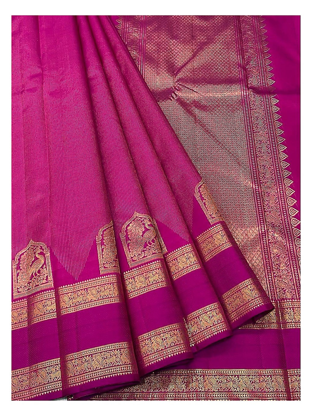 Handwoven Kanchipuram Silk Saree in Magenta Pink with Gold Zari Peacock Border