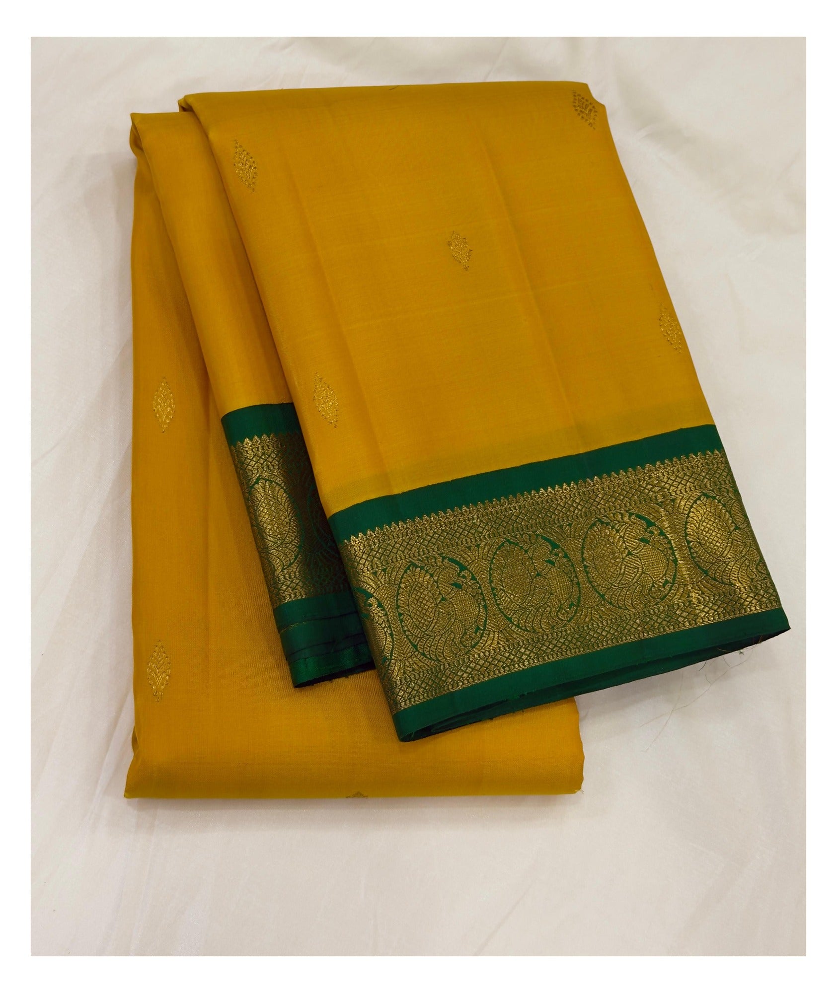 Handwoven Kanchipuram Silk Saree in Mustard Yellow with Emerald Green Zari Border front view
