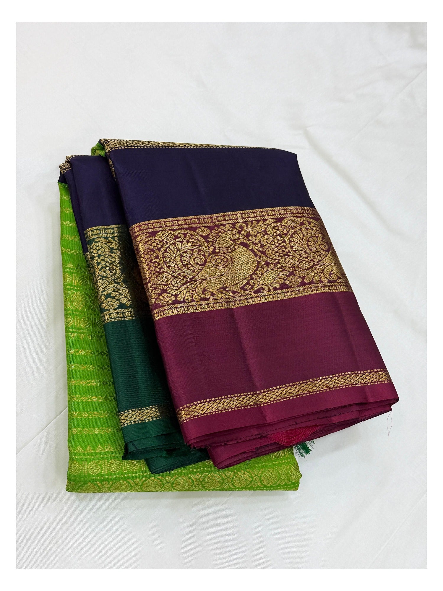 Handwoven Kanchipuram Silk Saree in Parrot Green with Navy Blue and Magenta Peacock Border front view