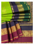 Handwoven Kanchipuram Silk Saree in Parrot Green with Navy Blue and Magenta Peacock Border