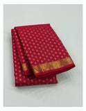 Rani pink handwoven Kanchipuram silk saree folded to show gold buttas and zari border