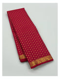 Rani pink Kanchipuram silk saree with repeating gold buttas and traditional zari border