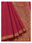 Rani pink handwoven silk saree with richly woven zari pallu and gold butta body