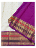 Magenta pallu and contrast border with rich gold-toned woven detailing on ivory saree
