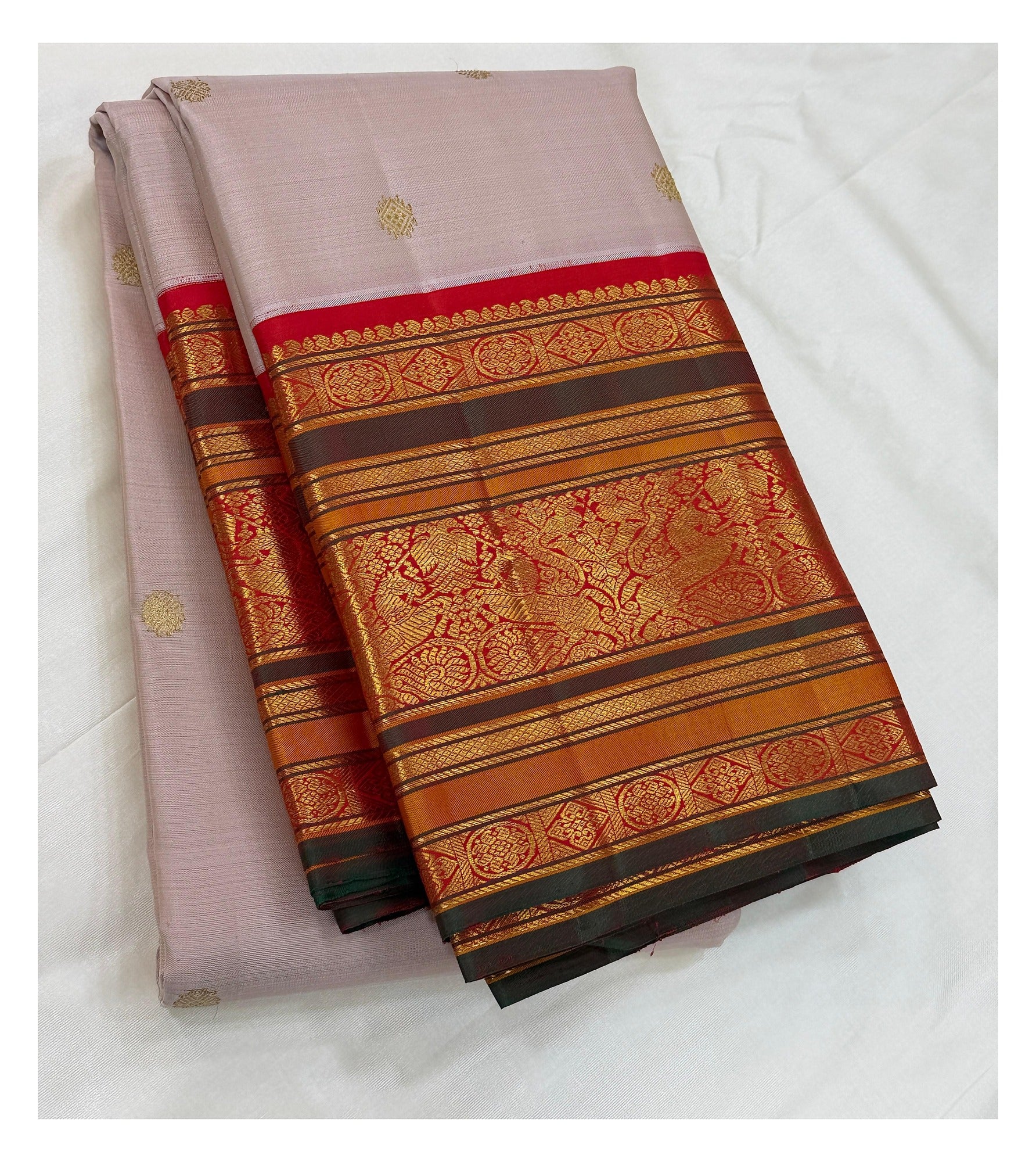 Handwoven Kanchipuram silk saree in soft blush pink with folded vermilion red and antique gold border