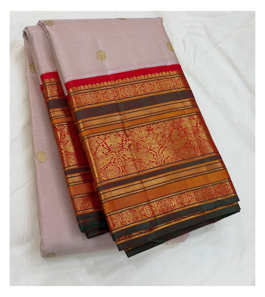 Handwoven Kanchipuram silk saree in soft blush pink with folded vermilion red and antique gold border